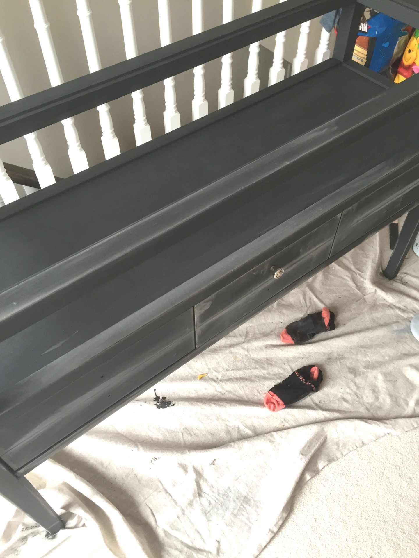 picture of console table being sanded refinishing a console table with chalk paint