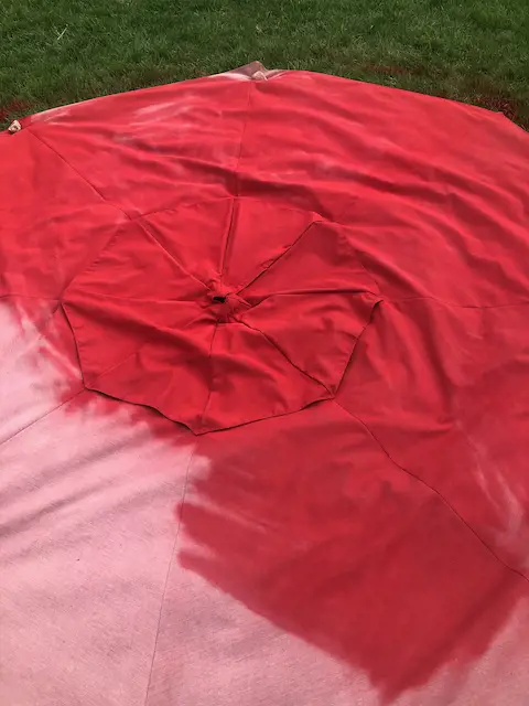 spray painting a patio umbrella