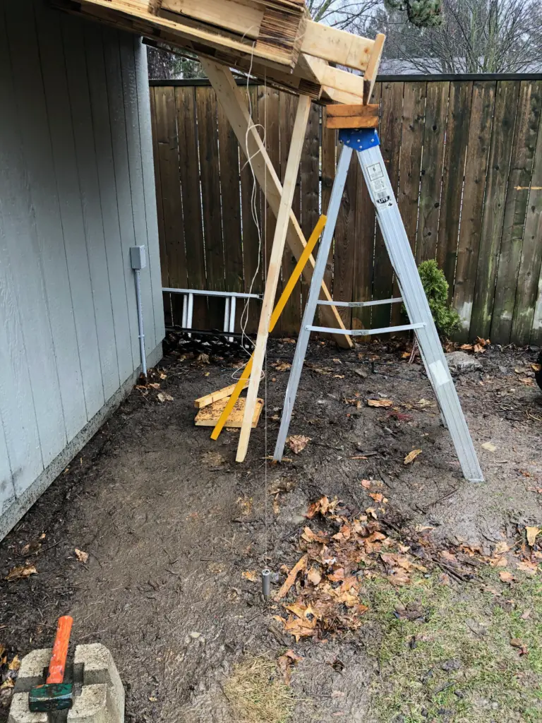 Using a pendulum weight to mark the location for posts Using a pendulum weight to mark the location for posts