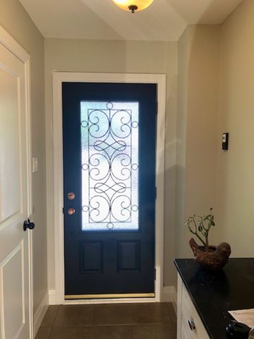 Flat Black Front Door with Gold Accents